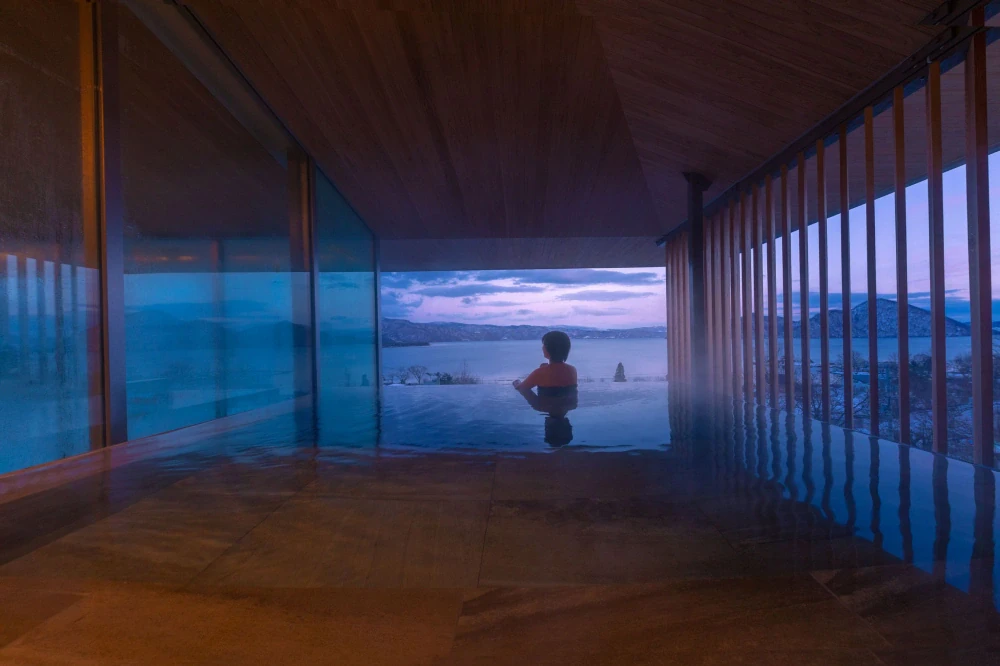 Dusit International brings its Dusit Collection  brand to Japan with the opening of a Kengo  Kuma-designed lakeside retreat in Hokkaido